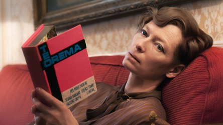 Tilda Swinton with a book